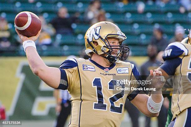 Brian Brohm of the Winnipeg Blue Bombers makes a pass against the Edmonton Eskimos during a CFL game at Commonwealth Stadium on October 13, 2014 in...