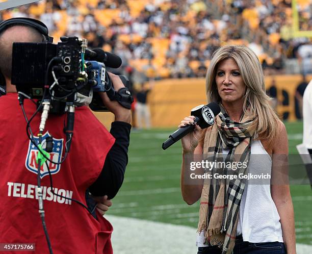 Fox NFL sideline reporter Laura Okmin reports from the sideline during a National Football League game between the Tampa Bay Buccaneers and the...