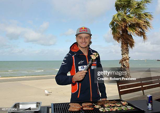 Australia's future star of MotoGP Jack Miller cooks an Aussie BBQ on the foreshore of St Kilda Sea Baths on October 14, 2014 in Melbourne, Australia.