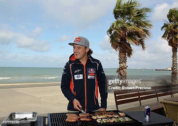 Australia's future star of MotoGP Jack Miller cooks an Aussie BBQ on the foreshore of St Kilda Sea Baths on October 14, 2014 in Melbourne, Australia.