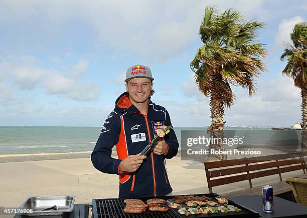 Australia's future star of MotoGP Jack Miller cooks an Aussie BBQ on the foreshore of St Kilda Sea Baths on October 14, 2014 in Melbourne, Australia.