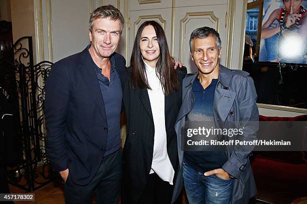 Philippe Caroit, Nathalie Garcon and Nagui attend the Nathalie Garcon's Book Signing Cocktail Party At Hotel Regina on October 13, 2014 in Paris,...