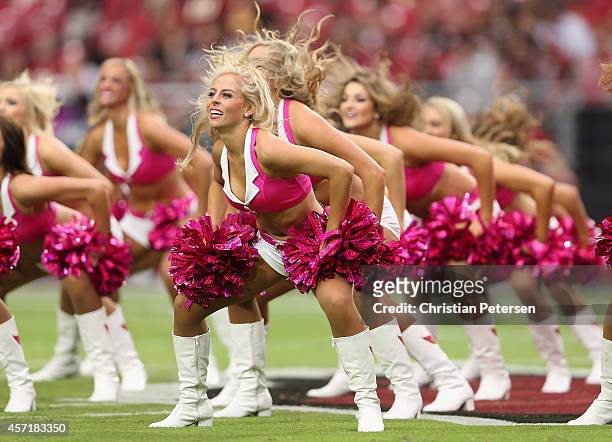 Arizona Cardinals cheerleaders perform during the NFL game against the Washington Redskins at the University of Phoenix Stadium on October 12, 2014...