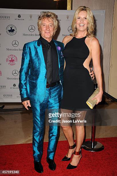 Singer Rod Stewart and model Penny Lancaster attend the 2014 Carousel of Hope ball at The Beverly Hilton Hotel on October 11, 2014 in Beverly Hills,...