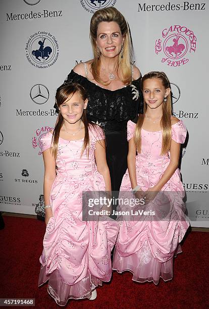 Ariana Rickel, Isabella Rickel and Nancy Davis attend the 2014 Carousel of Hope Ball at The Beverly Hilton Hotel on October 11, 2014 in Beverly...