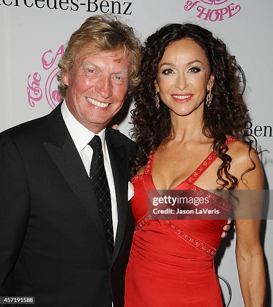 Nigel Lythgoe and Sofia Milos attend the 2014 Carousel of Hope Ball at The Beverly Hilton Hotel on October 11, 2014 in Beverly Hills, California.