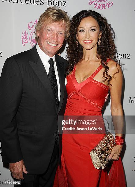 Nigel Lythgoe and Sofia Milos attend the 2014 Carousel of Hope Ball at The Beverly Hilton Hotel on October 11, 2014 in Beverly Hills, California.