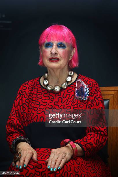 British fashion designer Zandra Rhodes poses for photographers as she recreates Rembrandt's 'Portrait of Catrina Hooghsaet' in front of the original...