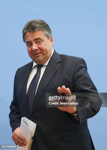 German Vice Chancellor and Economy and Energy Minister Sigmar Gabriel departs after presenting the German government's revised economic outlook on...