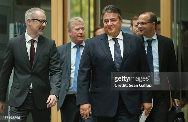 German Vice Chancellor and Economy and Energy Minister Sigmar Gabriel arrives to present the German government's revised economic outlook on October...