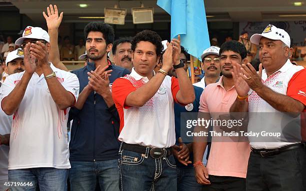 Cricketer Sachin Tendulkar addresses during the flag-off ceremony of CRPF Half Marathon- Run for Unity as a part of the 75th Raising Day celebration...