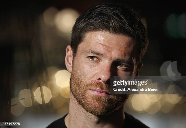 Bayern Muenchen player Xabi Alonso gives an interview during his visit at the FC Bayern Erlebniswelt museum at Allianz Arena on October 14, 2014 in...