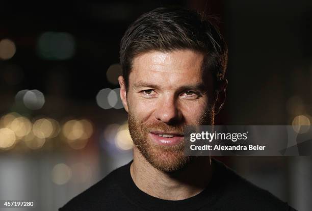 Bayern Muenchen player Xabi Alonso gives an interview during his visit at the FC Bayern Erlebniswelt museum at Allianz Arena on October 14, 2014 in...