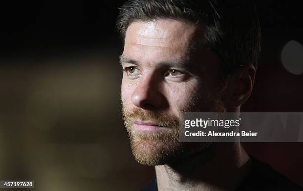 Bayern Muenchen player Xabi Alonso gives an interview during his visit at the FC Bayern Erlebniswelt museum at Allianz Arena on October 14, 2014 in...