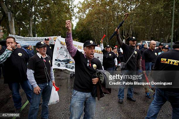 Taxi drivers protest against new private cab 'UBER' application on October 14, 2014 in Madrid, Spain. 'Uber' application started to operate in Madrid...
