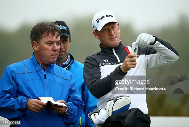 Jamie Donaldson of Wales with caddy Mick Donaghy during the pro-am for the Volvo World Matchplay at The London Club on October 14, 2014 in Ash,...