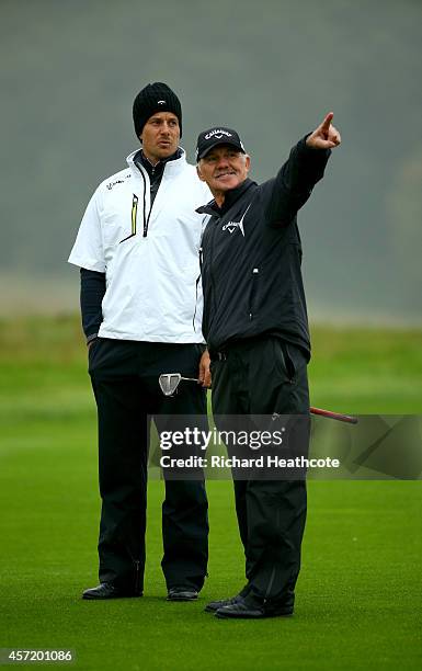Henrik Stenson of Sweden with coach Pete Cowan during the pro-am for the Volvo World Matchplay at The London Club on October 14, 2014 in Ash, England.