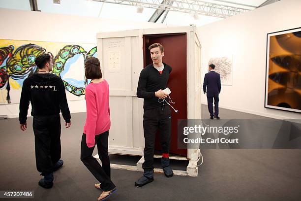 Visitors view an installation by artist Gregor Schneider entitled 'Nursery during the VIP and press day at the Frieze Art Fesival on October 14, 2014...