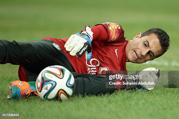 Goalkeeper Marcelo Grohe warms up before the international friendly match between Japan and Brazil at the National Stadium on October 14, 2014 in...