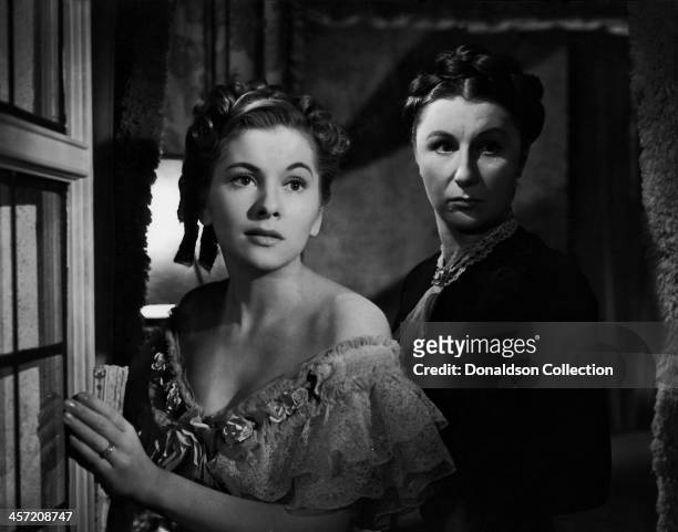 Actress Joan Fontaine and Judith Anderson pose for a portrait for the movie 'Rebecca' released in 1940.