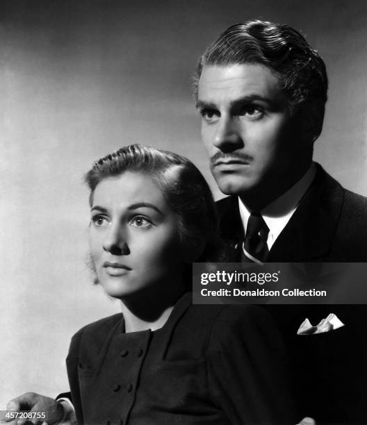 Actress Joan Fontaine and Laurence Olivier pose for a portrait for the movie 'Rebecca' released in 1940.