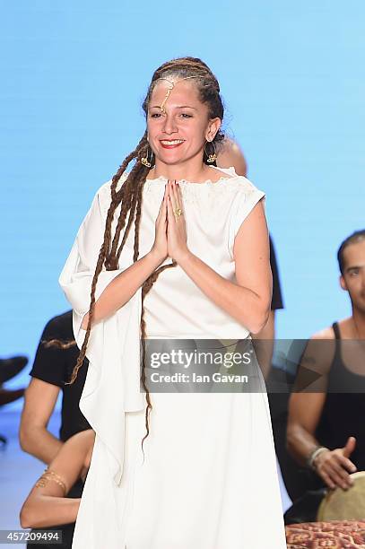 Fashion designer Simay Bulbul acknowledges the applause of the audience after the Simay Bulbul show during Mercedes Benz Fashion Week Istanbul SS15...