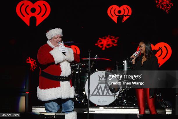 Hot 99.5's Toby Knap and Hot 99.5's Danni of The Kane Show perform onstage during Hot 99.5s Jingle Ball 2013, presented by Overstock.com, at Verizon...