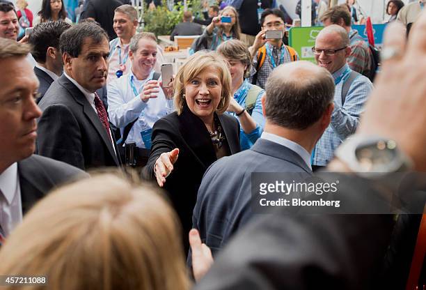 Hillary Clinton, former U.S. Secretary of state, center, greets attendees during the DreamForce Conference in San Francisco, California, U.S., on...