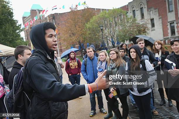 Saint Louis University student Jonathan Pulphus speaks to other students about racial injustice at a small camp on the university campus on October...