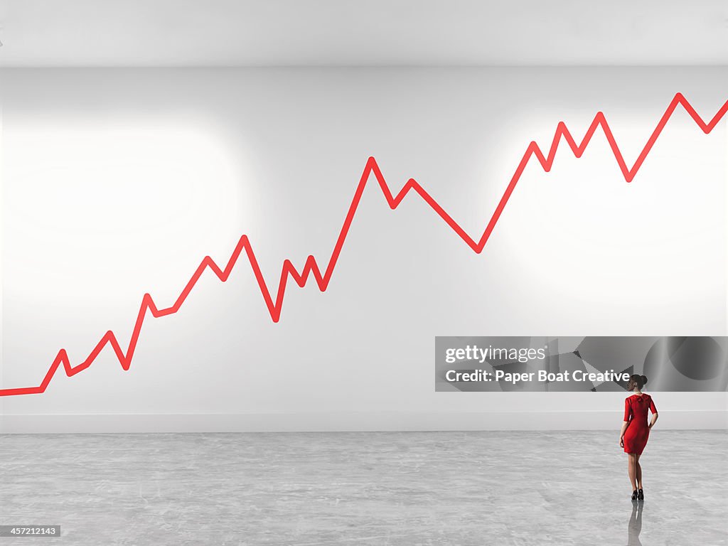 Woman looking up at zig zag line in gallery