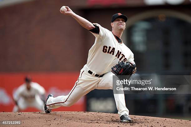 Tim Hudson of the San Francisco Giants pitches in the first inning against the St. Louis Cardinals during Game Three of the National League...
