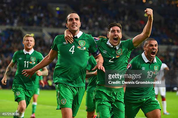 John O'Shea of the Republic of Ireland celebrates scoring the stoppage time equaliser with Stephen Ward and Jon Walters of the Republic of Ireland...