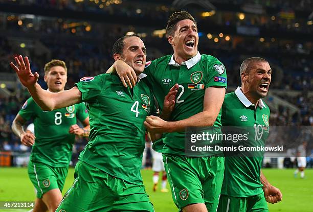 John O'Shea of the Republic of Ireland celebrates scoring the stoppage time equaliser with Stephen Ward and Jon Walters of the Republic of Ireland...