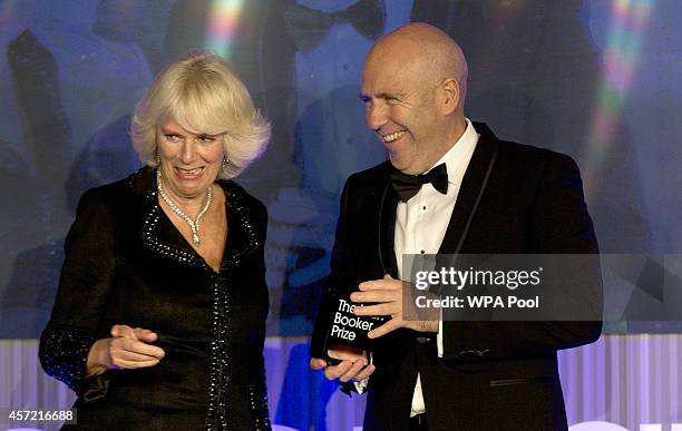 Winner of the Man Booker for fiction 2014 Australian, Richard Flanagan author of 'The Narrow Road to the Deep North', is congratulated by Camilla,...