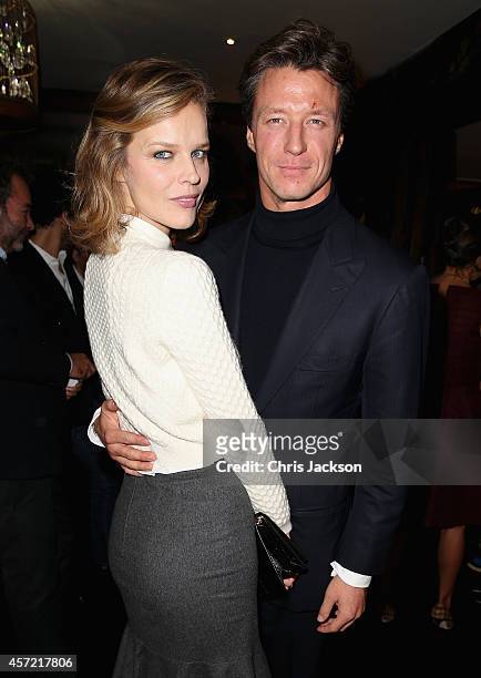 Eva Herzigova and Gregorio Marsiaj attend a dinner at China Tang after Moncler hosted the 'Monuments' Exhibition with Leica on October 14, 2014 in...