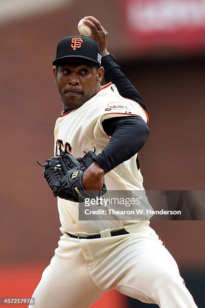 Santiago Casilla of the San Francisco Giants pitches in the ninth inning against the St. Louis Cardinals during Game Three of the National League...