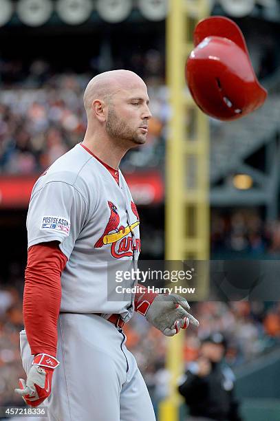 Matt Holliday of the St. Louis Cardinals throws his helmet after he grounds out to end the 10th inning against the San Francisco Giants during Game...