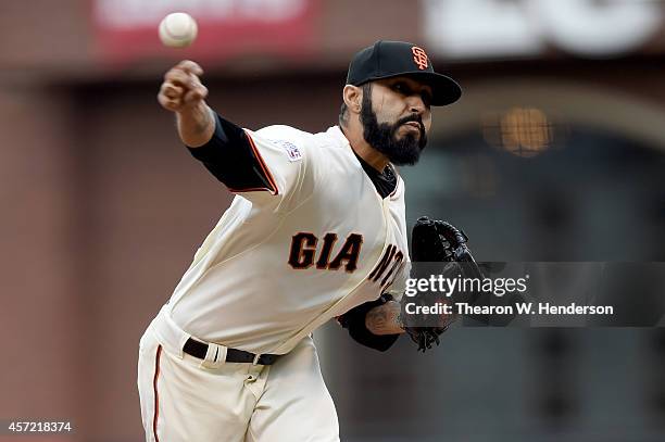 Sergio Romo of the San Francisco Giants pitches in the 10th inning against the St. Louis Cardinals during Game Three of the National League...