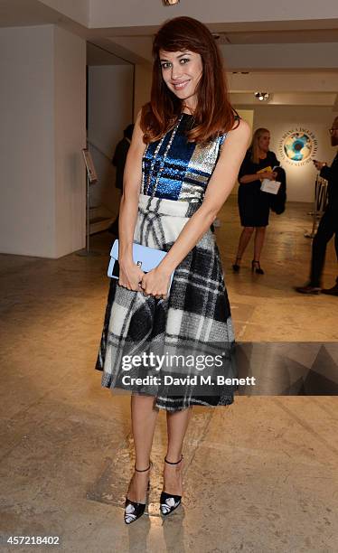 Olga Kurylenko attends the Bianca Jagger Human Rights Foundation "Arts for Human Rights" benefit gala auction at Phillips Gallery on October 14, 2014...
