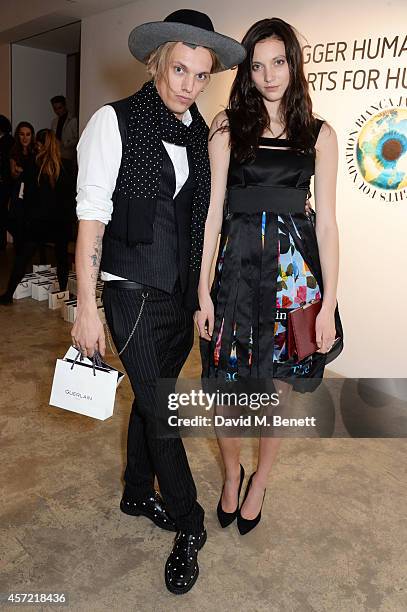 Jamie Campbell Bower and Matilda Lowther attend the Bianca Jagger Human Rights Foundation "Arts for Human Rights" benefit gala auction at Phillips...