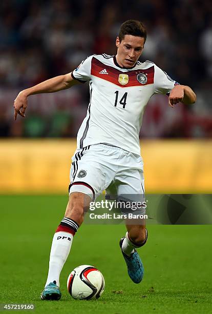 Julian Draxler of Germany runs with the ball during the EURO 2016 Group D qualifying match between Germany and Republic of Ireland on October 14,...