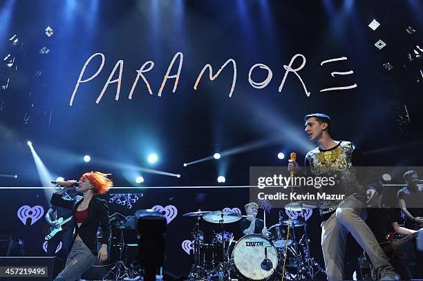 Hayley Williams of Paramore and a fan perform onstage during Hot 99.5s Jingle Ball 2013, presented by Overstock.com, at Verizon Center on December...