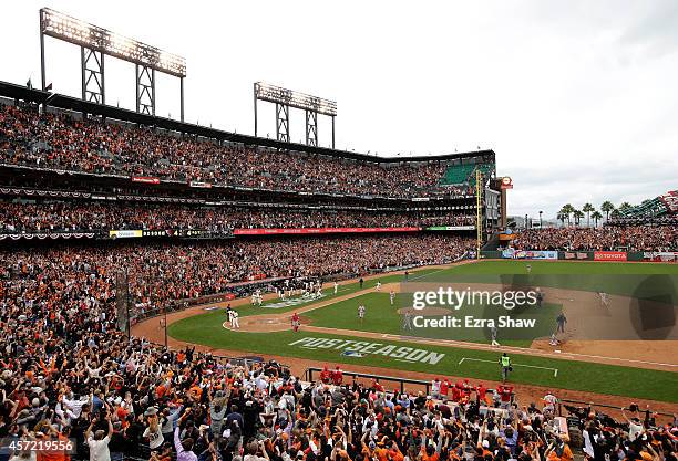 The San Francisco Giants celebrate the 5-4 10th inning victory against the St. Louis Cardinals during Game Three of the National League Championship...
