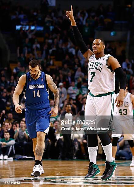 Jared Sullinger of the Boston Celtics reacts following a made three-point shot late in the fourth quarter against the Minnesota Timberwolves during...
