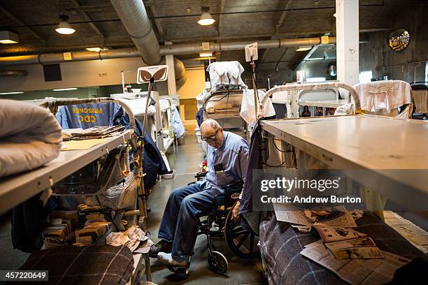 Edward Crawford , age 54, uses his wheelchair to go and watch television during free time in his cell block at California State Prison, Solano, on...