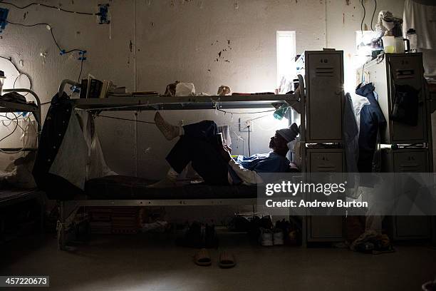 Richard Moss, age 63, reads a book in his bunk during free time at California State Prison, Solano, on December 16, 2013 in Vacaville, California. In...