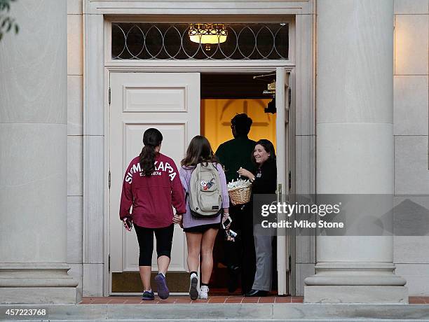 Members of the Kappa Sigma sorority enter the chapel for a prayer vigil on the campus of TCU for health care worker Nina Pham who contracted the...