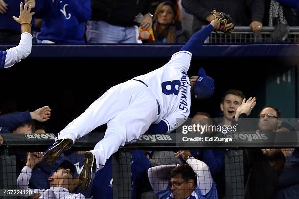 Mike Moustakas of the Kansas City Royals catches a foul ball hit by Adam Jones of the Baltimore Orioles in the sixth inning during Game Three of the...