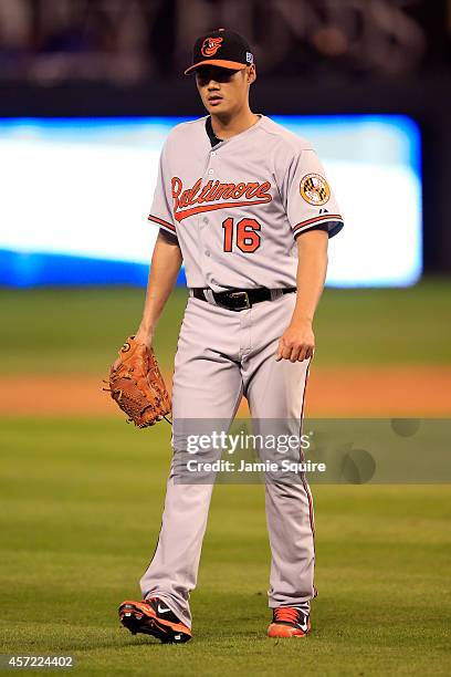 Wei-Yin Chen of the Baltimore Orioles walks back to back to the dugout in the third inning against the Kansas City Royals during Game Three of the...