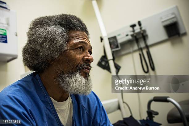 George Whitfield, age 56, speaks to a physical therapist regarding shoulder pain, at California State Prison, Solano, on December 16, 2013 in...